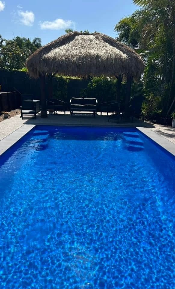 Thatched Bali hut beside the pool — photograph 6