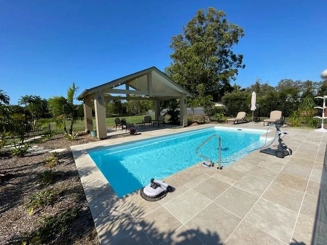 Pool pavilion with insulated Stratco roof — photograph 13